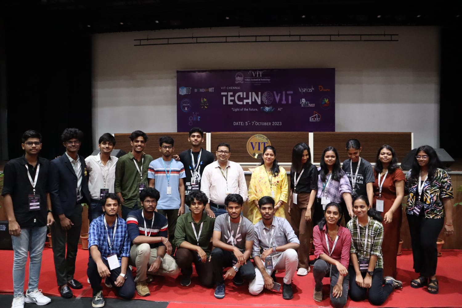 Dr. Pritam Bhowmik with a student team inside an auditorium during Technovit
